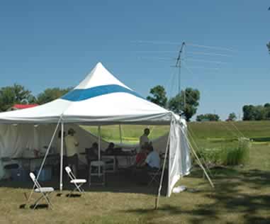 The tent was open across the front; the rear wall was dropped to allow ventilation in the hot weather.