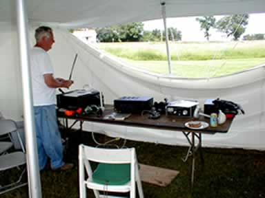 Henry/KT1J and the rig, an FT100 with Acom amplifier.