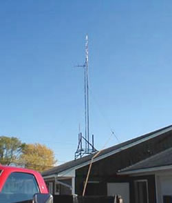 Truck attached to tower guy-line.